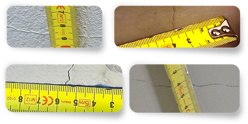 Example of a hairline crack in painted plaster wall