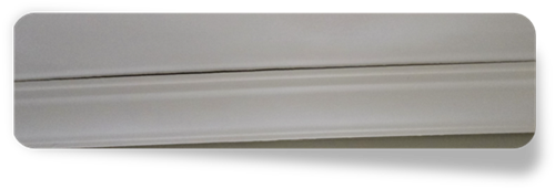 Close-up of cornice crack at ceiling joint